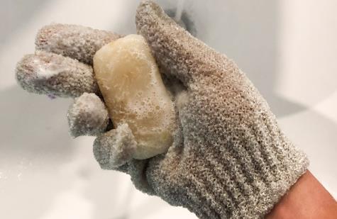 Dampen the Gloves and Put Exfoliating Product on Them